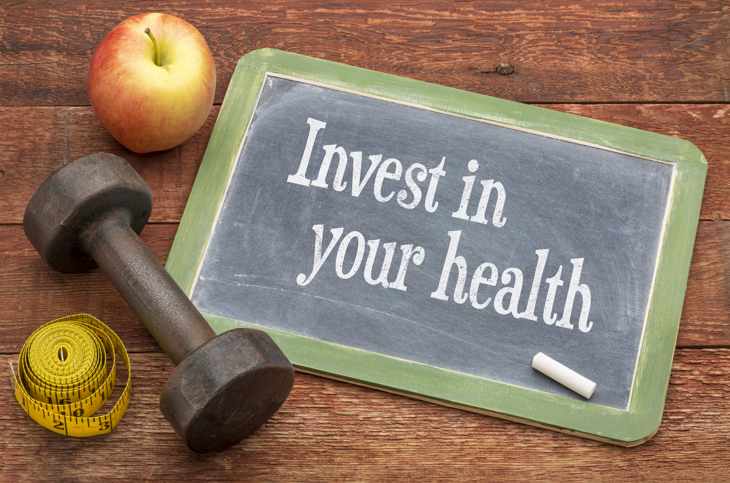 Invest,In,Your,Health,-,Slate,Blackboard,Sign,Against,Weathered