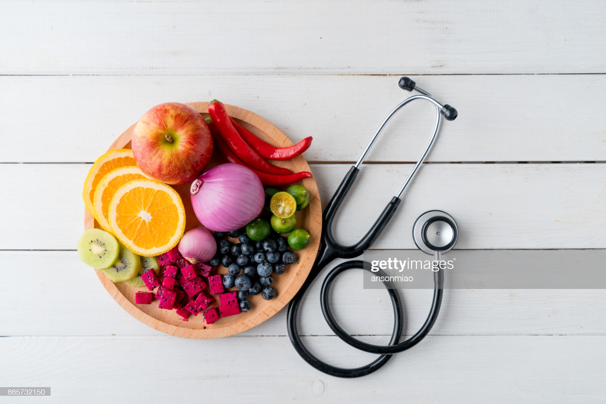 Healthy food in heart dish with doctor's stethoscope